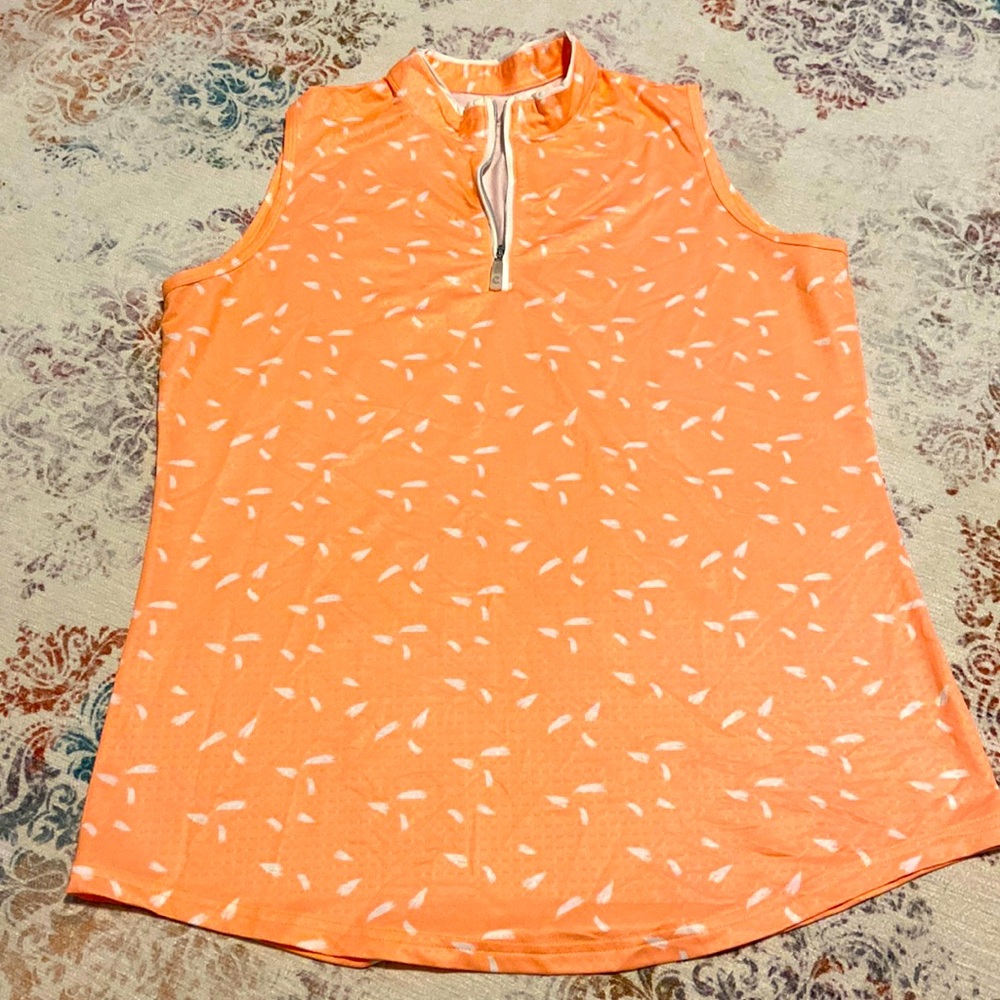 Womens sleeveless golf/tennis shirt. Size L.